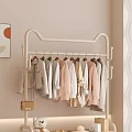 Living Room With Beige Walls White Clothing Rack Light Colored Clothes And Orange Circle Artwork