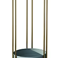 Blue Ceramic Planters On Gold Metal Plant Stands In Modern Room With Gray Curtains