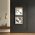 Abstract Ink Wash Paintings In Decorative Frames Hanging On Dark Wall For Interior Decor