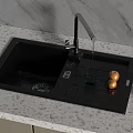 Black Kitchen Sink With Faucet Water Dripping Draining Board And Vegetables On Marble Countertop