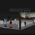 Modern Auto Show Booth Featuring Large Screen Display Cars Seats And Attendees