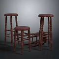 Three Wooden Stools With Classic Design And Carved Legs In Various Heights