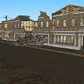 Old Brick Storefront Buildings With Vintage Signage And Utility Poles On Cobblestone Street