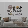 Various Stylish Hats Hanging On Wall In Modern Living Room With Sofa Pillows And Plants