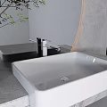 Modern Washbasin Vanity With Marble Countertop Circular Backlit Mirror Green Plant And White Cabinet