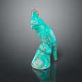 Turquoise Colored Parrot Statue With Red Crest Standing On Spiral Pattern Base Against Dark Background