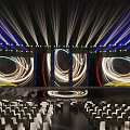 Grand Event Venue With Stage Lighting And Audience Seats