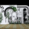 Elegant Wedding Backdrop With White Arch Green Plants And Floral Decorations On Checkerboard Floor