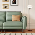 Modern Green Leather Three-Seater Sofa With Wall Decorative Paintings Floor Lamp And Palm Plant