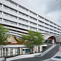 Modern Commercial Complex Architectural Exterior With Multi storey Glass Curtain Wall And Greenery Entrance Design