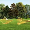 Yellow Geometric Landscape Seats on Green Grass Surrounded by Lush Trees