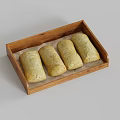 Freshly Baked Bread Rolls in Wooden Tray with Baking Paper Lining