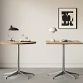 Two Dining Tables Round Square With Metal Legs Black White Table Lamps And Decorative Artwork