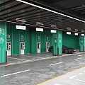 Underground Parking Garage With Electric Vehicle Charging Stations Green Walls And Parked Cars