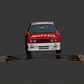 Red and white racing car with BASTOS MOTUL logos number 83 on track surface