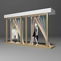 Store Window Design Featuring Mannequin In Black Dress Hanging White Clothes And Colorful Decorative Strips
