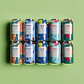 Colorful Beverage Cans Neatly Arranged On Green Background With Vibrant Designs