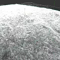 Natural Microtopography Featuring Rocky Terrain Snow Patches And Sparse Grass