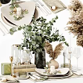 Decorative Ornament Set with Eucalyptus Plant Wine Glasses Books Candles and Dried Flowers
