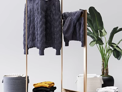 Modern Metal Clothes Rack With Knitted Sweater Green Plant Folded Clothes And Baskets 3d model