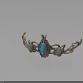 Ornate Metal Decorative Ornament With Blue Gemstone Green Stones And Vine Design
