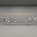 Hanging Art Installation With Silver Circular Rings And Red Ropes On Gray Background