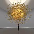Golden Jewelry Art Installation With Hanging Intricate Decorative Pieces And Person Admiring