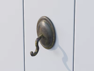 Antique Brass Decorative Hook Mounted On Smooth White Wooden Door Surface 3d model