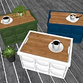 Green Blue White Storage Boxes With Wooden Lids Coffee Cups And Small Potted Plants