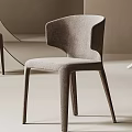 Modern Minimalist Dining Chairs With Curved Fabric Backrest And Slim Wooden Legs In Beige Interior