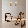 Modern Wooden Dining Chairs With Woven Seats In Light Interior Space With Wall Lighting