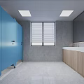 Public Restroom Interior Featuring Blue Cubicles Gray Tiled Walls Wooden Vanity And White Countertop