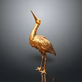 Elegant Golden Crane Sculpture with Detailed Feathers on Dark Background