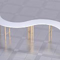 Tea Break Area Featuring White Curved Table With Golden Thin Legs On Gray Checkered Floor