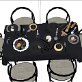 Elegant Black Tableware Collection With Fruits Candles And Wine Glasses On Table