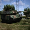 Military Camouflage Main Battle Tank On Grassland With Trees And Power Tower