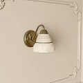 Elegant Vintage Brass Wall Lamp With White Textured Shade On Beige Wall