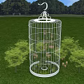 White Birdcage Art Installation Placed On Green Grass Field With Small Trees