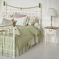 White Iron Bed With Gold Accents Green Quilt Floral Pillows And Bedside Lamp