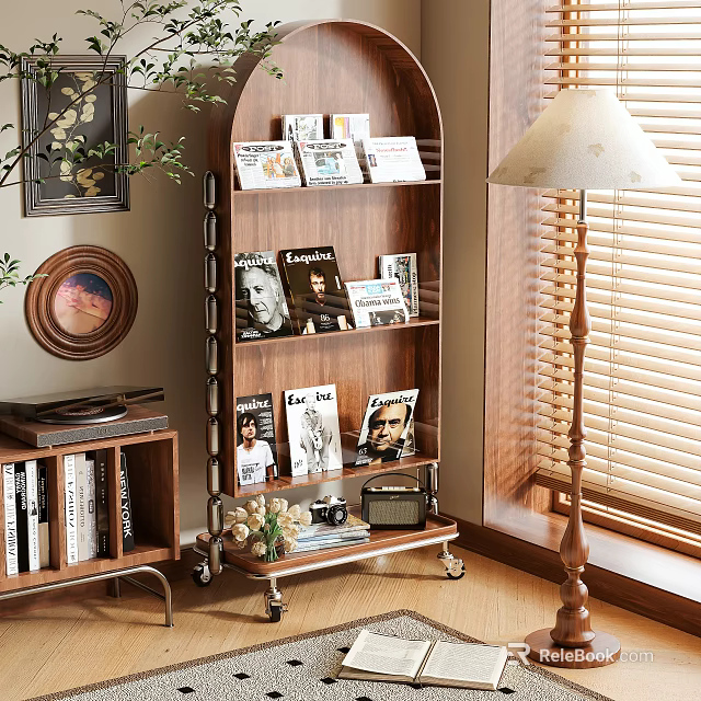 Wooden Shelf With Magazines Books And Decorations Near Table Lamp And Window Blinds 3d model 