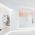 Modern Clothing Store Interior Featuring White Walls Orange Accents Clothing Racks Plants And Display Tables