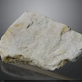 Natural White Yellow Stone Block With Raw Textured Surface And Reflective Base