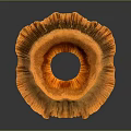 Golden Textured Decorative Object With Circular Hollow Center And Petal Like Edges