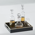 Elegant Ceramic Vessels On Black Tray With Gold Edge And Yellow Liquid Glass Cup