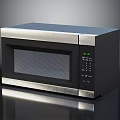 Modern Black And Silver Microwave Oven With Stainless Steel Trim Digital Display And Control Panel