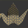 Origami Crane Paper Art With Yellow Circle Patterns On Dark Reflective Surface