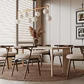 Elegant Modern Restaurant Dining Area With Round Table Wooden Chairs Pendant Lights And Framed
