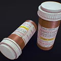 Two Brown Medicine Bottles Upright And Lying With Child Therapeutic Labels And Tablets