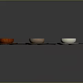 Various Colored Wooden And White Bowls And Plates For Daily Household Use