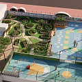 Rooftop Garden with Lush Green Plants Pathways and Basketball Court Area